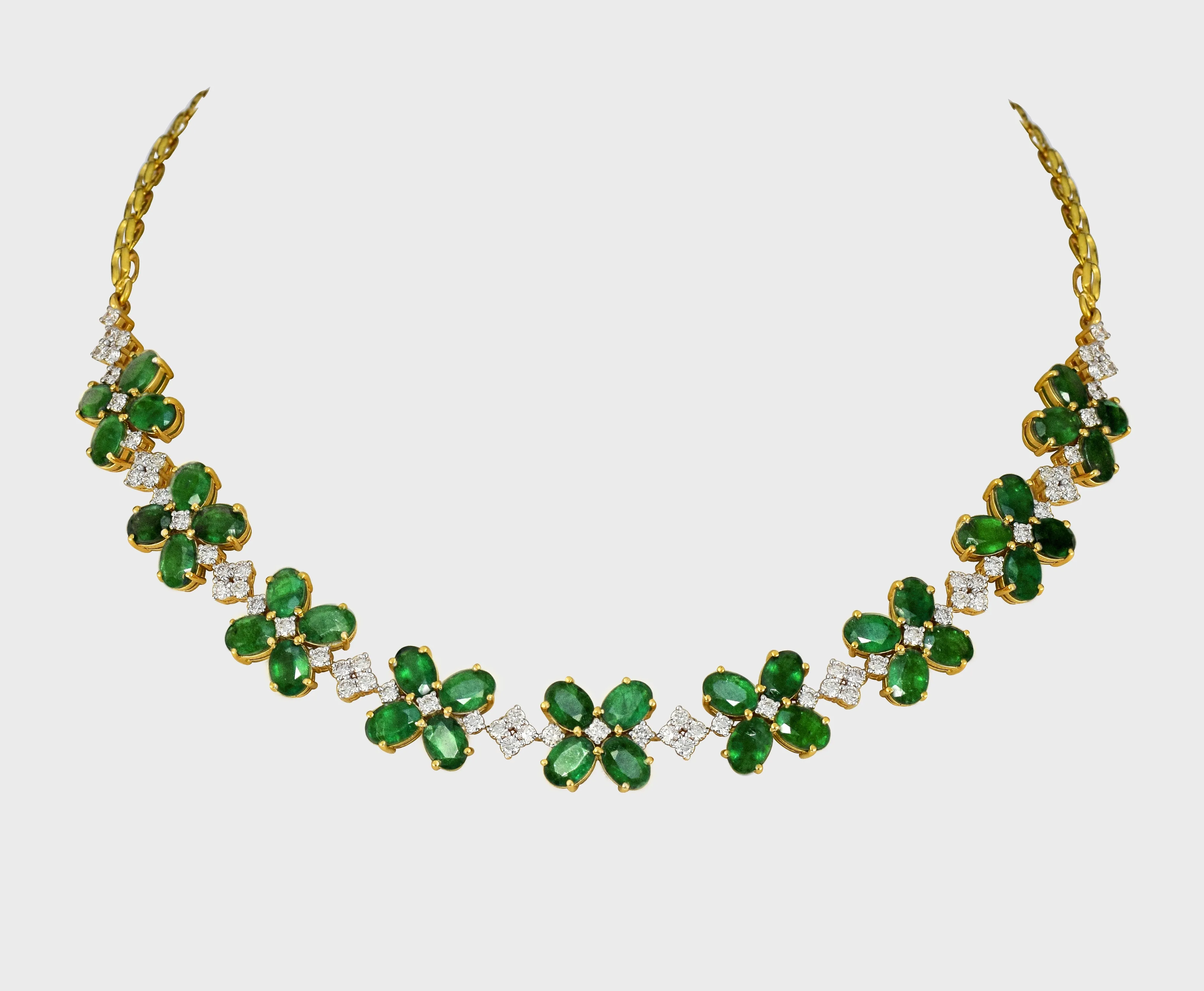 Our exquisite emerald and diamond necklace paired perfectly with luxurious tops, adding a touch of sophistication to any look.(GDNE0489)